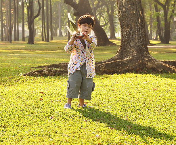 istock Boy with toy airplane 184924359