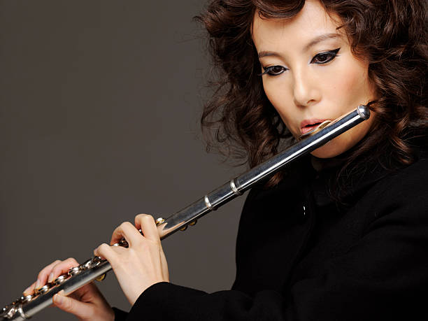 istock Woman playing flute 184924506