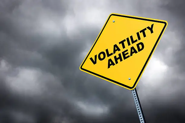 A road sign warning of volatility ahead against a stormyTo see more road signs click on the link below: