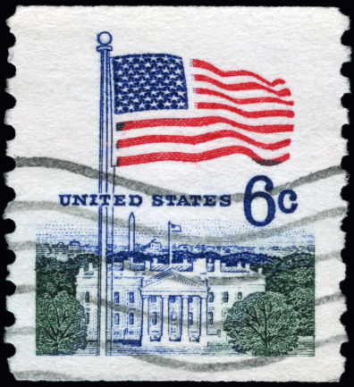 A Stamp printed in USA shows the 13-Star Flag, Independence Hall, circa 1975