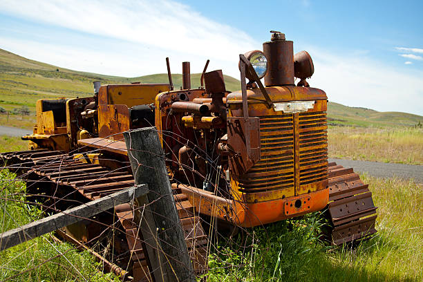 istock An old tractor in a green field on the tracks 184924714
