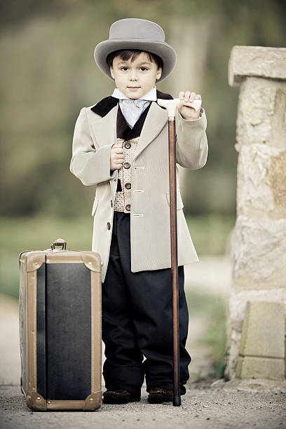 istock little boy as gentlemen in retro style with walking stick 184924832
