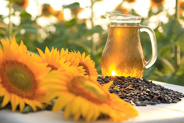 istock Oil bottle with sunflowers 184924984