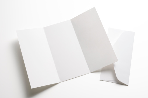 White blank booklet with envelope isolated on white background with clipping path.