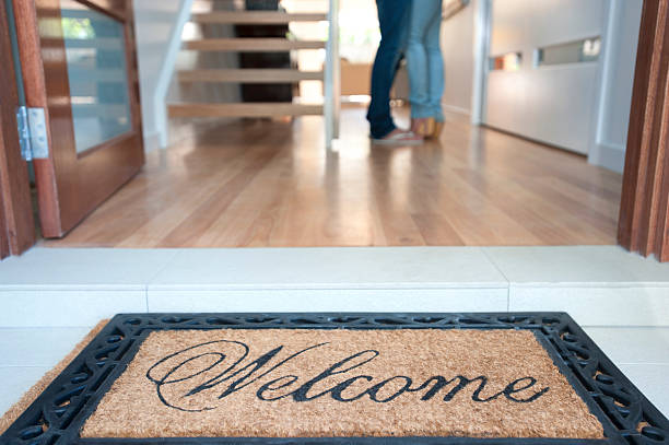 istock Happy young couple standing inside their new house 184925391