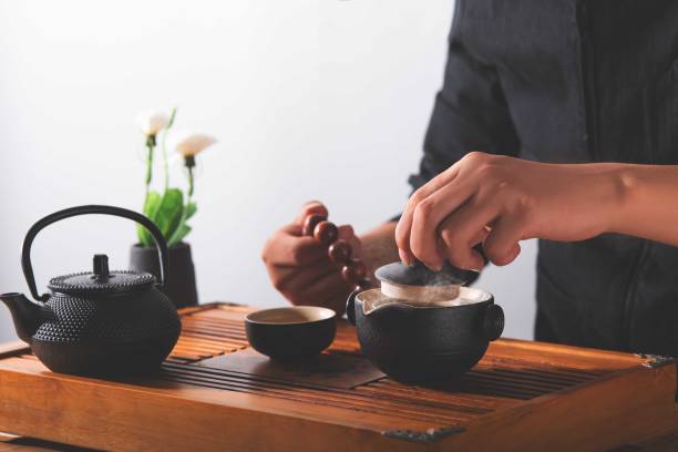 istock Man's hand is making tea at home, beautiful image of Asian style tea making 1849259339