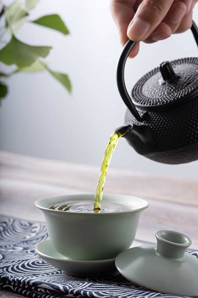 istock Man's hand is making tea at home, beautiful image of Asian style tea making 1849259362