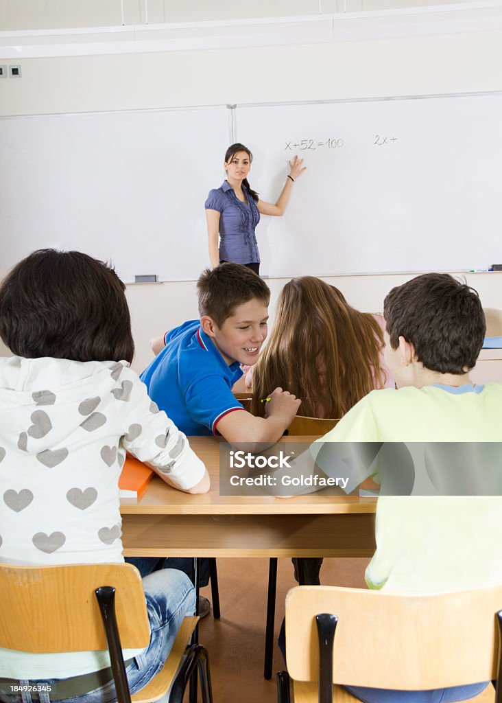 In Lesson Lesson In School Teacher Explaining A Task On Whiteboard Stock Photo ...