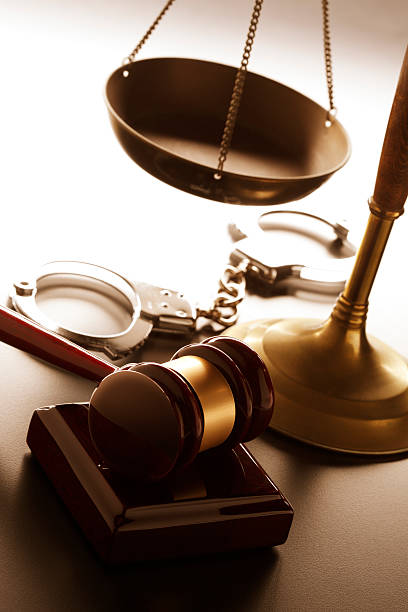 Justice "A gavel, a pair of handcuffs and a justice scale.For more legal images click here:" criminal justice stock pictures, royalty-free photos & images