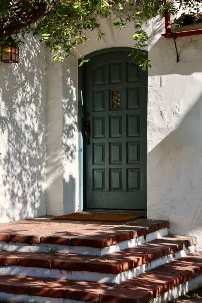 istock Mediterranean style building with decorative wood front door 1849278621