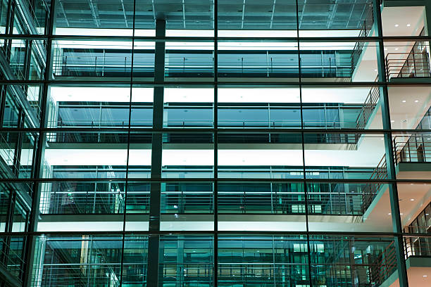 istock Illuminated Glass Office Building at Night 184927863