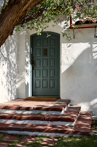 Spanish style building with decorative front entry
