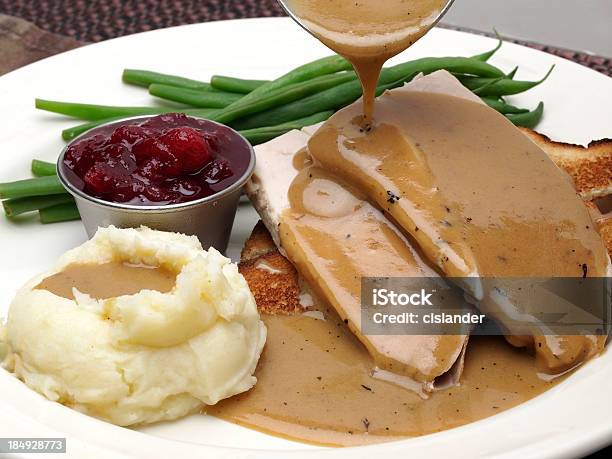 Plate Of Turkey With Gravy Mashed Potatoes And Green Beans Stock Photo - Download Image Now