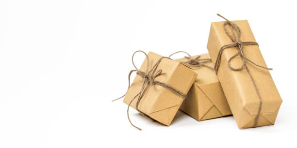 istock Brown crafted gift boxes and presents. Rustic aesthetic holiday celebration concept. Christmas holiday greeting template 1849288780