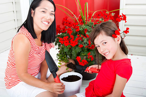 istock Mother and daughter gardening 184928932