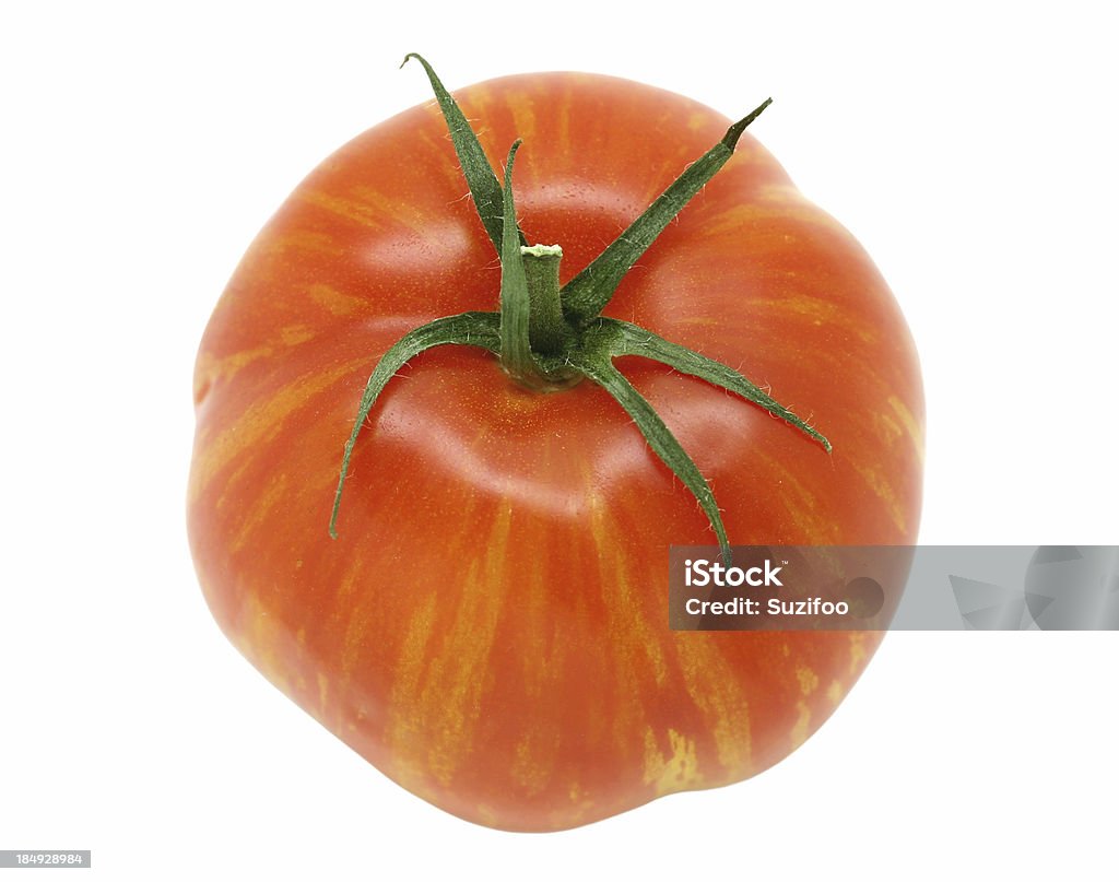 heirloom tomato "An heirloom tomato, isolated on white." Close-up Stock Photo