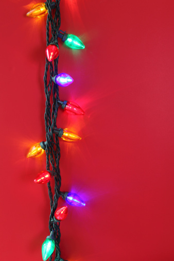 Christmas lights on red background