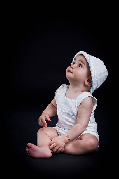 Adorable baby looking up.