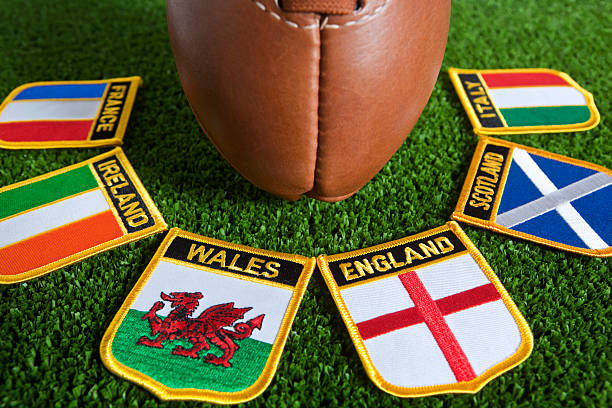 Six different nation's badges for rugby around a rugby ball stock photo