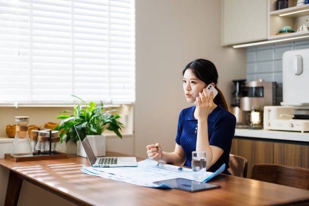 istock A female white-collar worker is working on a laptop in a dining room 1849296312