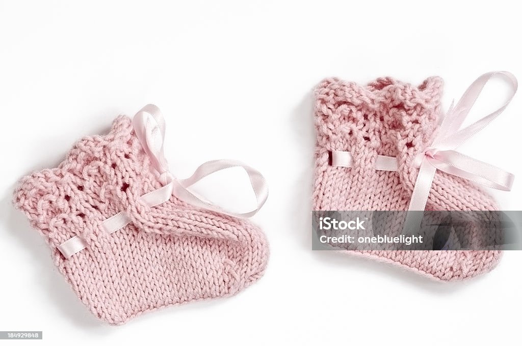 Pink Baby Booties on White Background Royalty free stock photo of pair pink baby booties on white backgroundSee More in Baby Booties Stock Photo