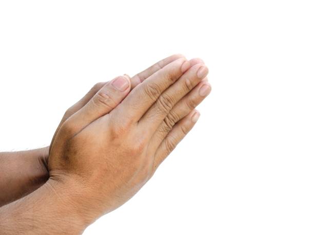 istock Male hands making a gesture of clasping hands in prayer.  Isolated on white background. 1849310098