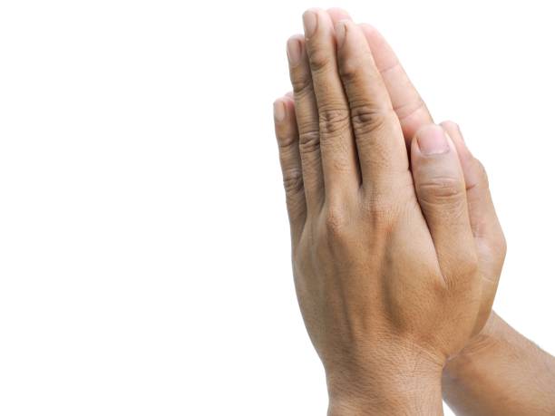 istock Male hands making a gesture of clasping hands in prayer.  Isolated on white background. 1849310105