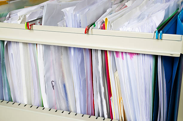 istock Filing cabinet with lots of paperwork 184931383