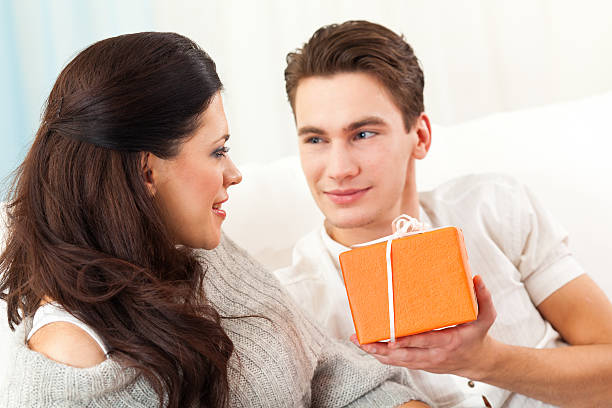 istock Man giving present to girl 184932161