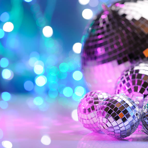 Party decoration with disco balls Party decoration with disco balls lit with colored bare flashes evening ball photos stock pictures, royalty-free photos & images