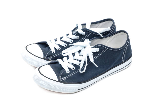 istock A pair of navy blue sneakers isolated on a white background. 1849322161