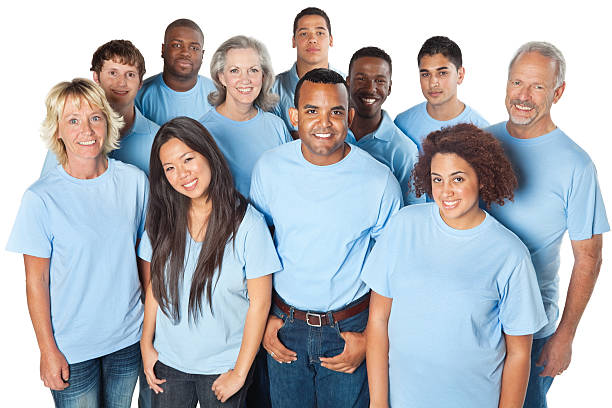 Happy group of people in blue shirts. Isolated on white background.