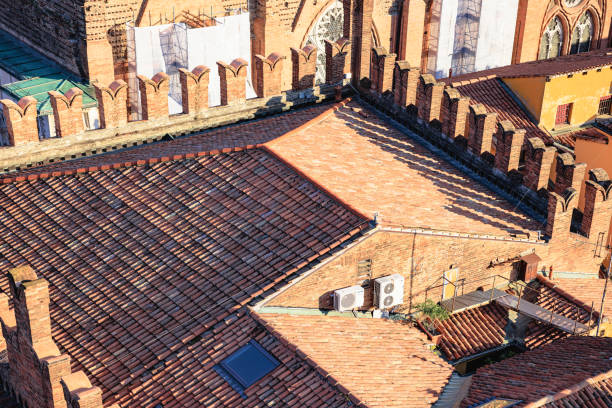 Tiled rooftop of historical complex in Bologna, Italy on a sunny day