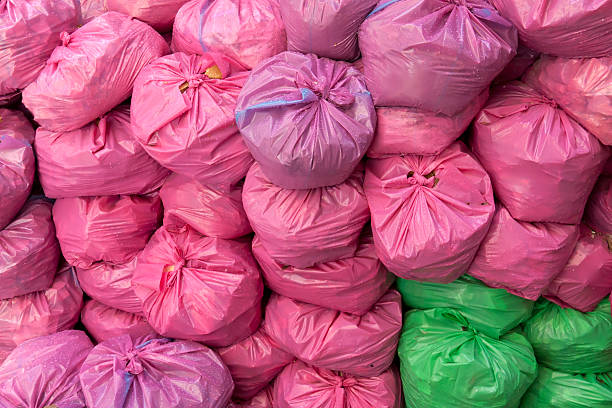 Pink And Green Plastic Garbage Bags Stock Photo - Download Image Now - Bag,  City, City Life - iStock
