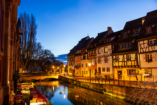 Colmar town called Little Venice with traditional half timbered houses along riverbank,France