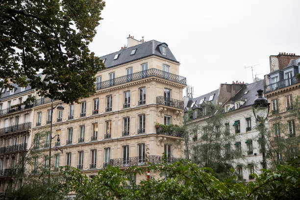 istock French city apartment building with trees in the foreground 1849333780