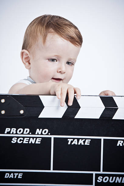 istock Adorable baby cinema director. 184933530