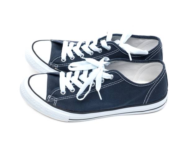 istock A pair of navy blue sneakers isolated on a white background. 1849335359