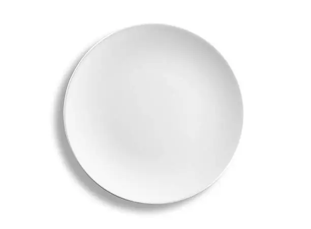 Empty round lunch or dinner plate isolated on white background, clipping path included, studio shot.