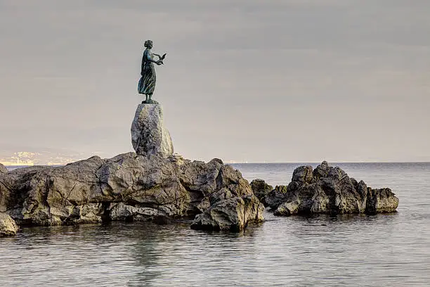 Historic statue on the rocks, symbol of Opatija-Croatia