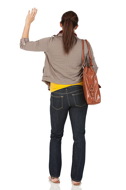 istock Rear view of a woman waving hands 184934667