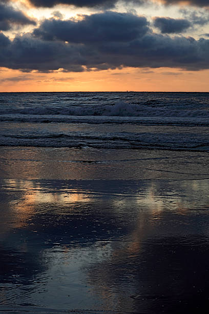 istock moody sky and its reflection in the water 184935031