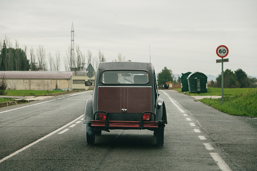 A vintage car on a road