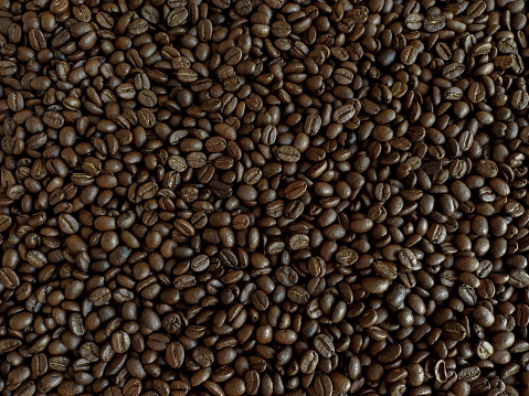 Roasted coffee beans stacked abstract background  Aromatic bitter coffee that is popular to eat in the morning to feel refreshed. cure drowsiness.