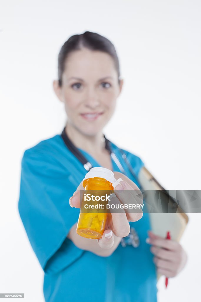 Nurse with Medication Nurse Holding Prescription pill bottlePlease see similar images in my portfolio: 25-29 Years Stock Photo