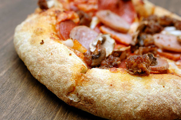 Tasty pizza served on a patterned plate with fresh ingredients and colorful ambiance.