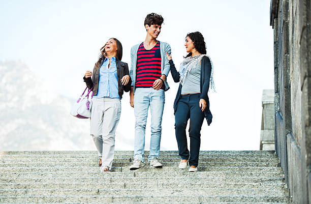 istock Three friends talking and enjoying while walking around city. 184935715