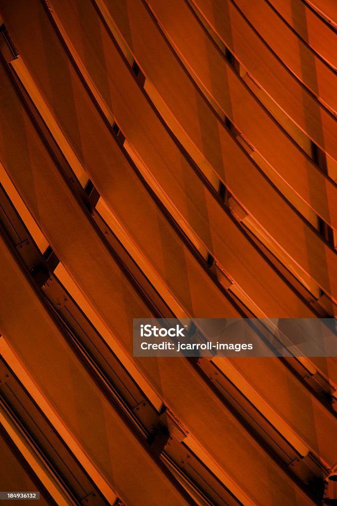 Dark orange curved abstract. Metal architectural elements provide interesting background.See all of my aArtistic and Abstract BackgroundaA images: Abstract Stock Photo