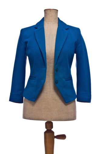 Female blazer in blue color on mannequin.