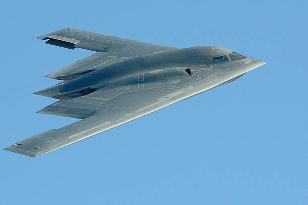 Close-up photo of a B-2 stealth bomber in flight B-2 during flyby at 2005 Edwards AFB air show military deployment photos stock pictures, royalty-free photos & images
